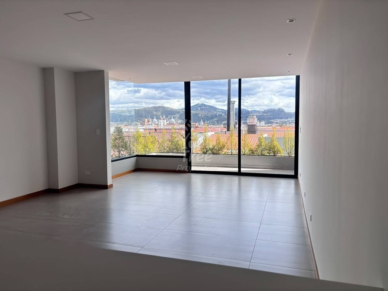 photo of the living area of a finished apartment, opening onto the terrace