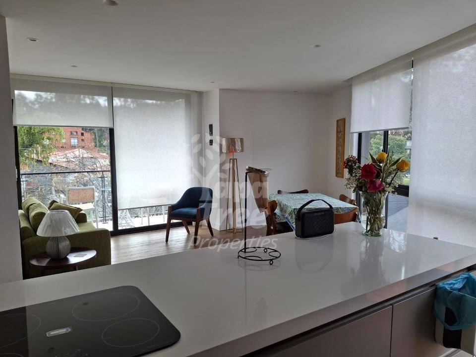 Bright 1-Bedroom Corner Suite with Private Terrace and Parking